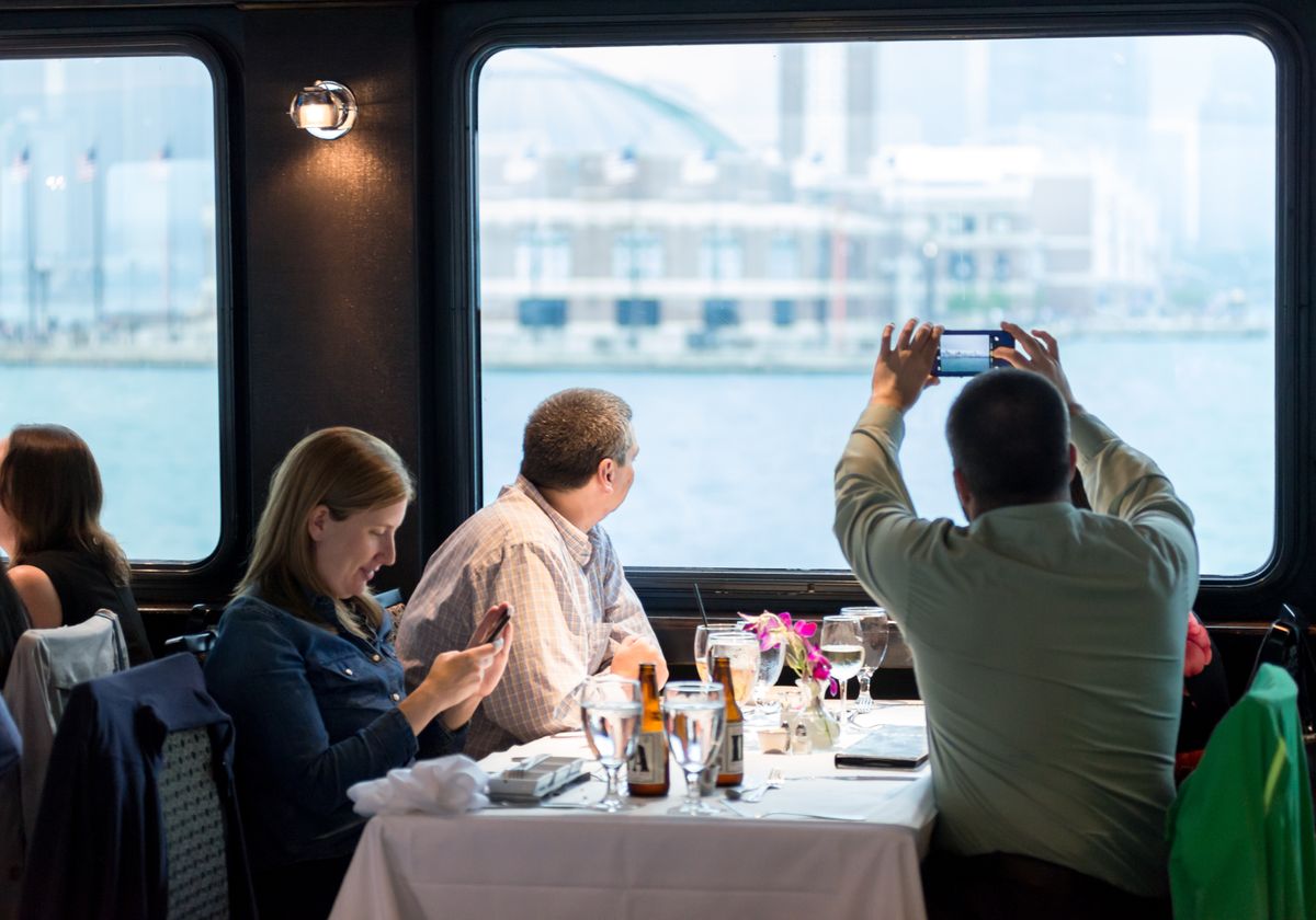 Man Taking a Picture of Navy Pier on Mother's Day Premier Brunch Cruise