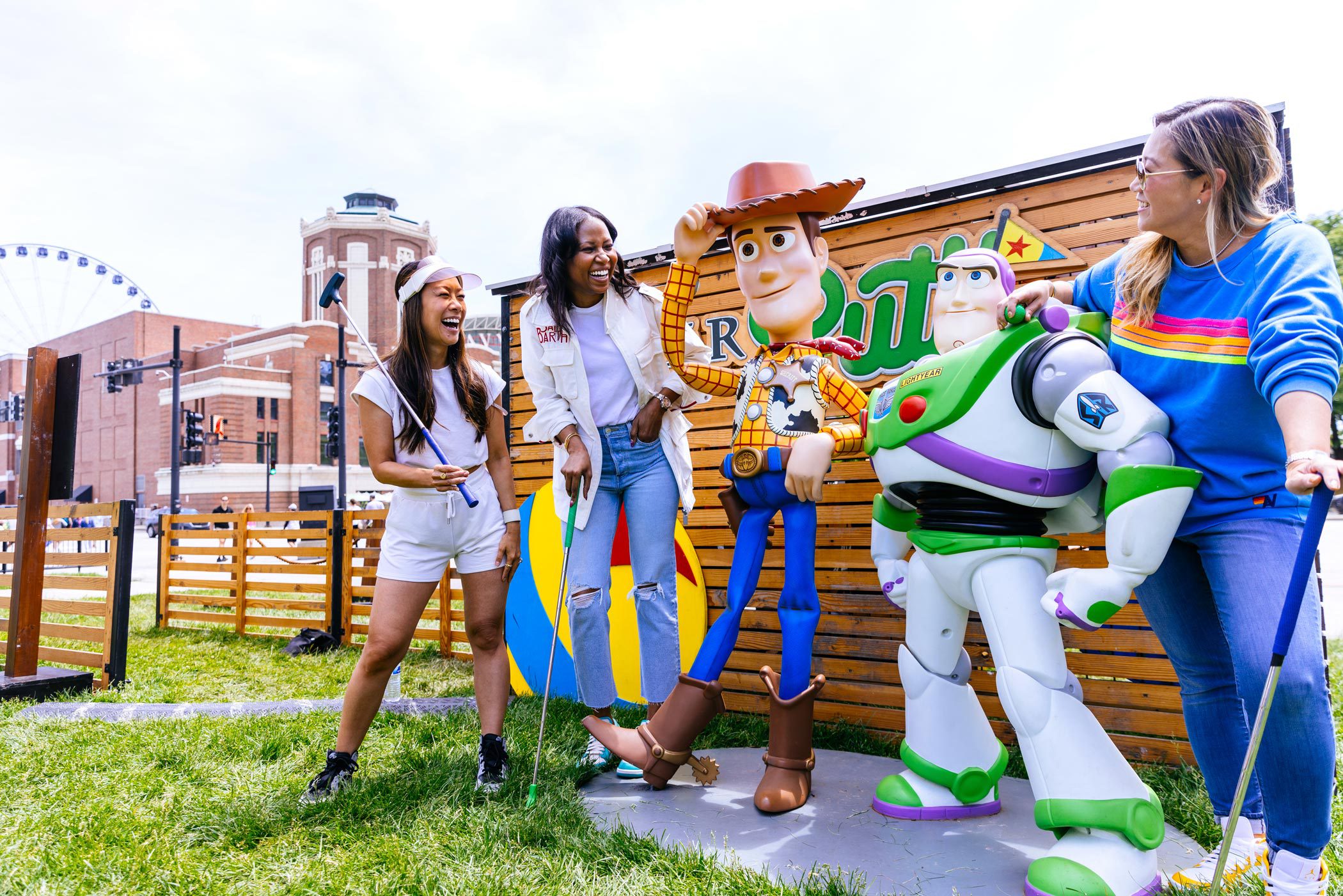 Friends Posing with Woody and Buzz at Pixar Putt at Navy Pier