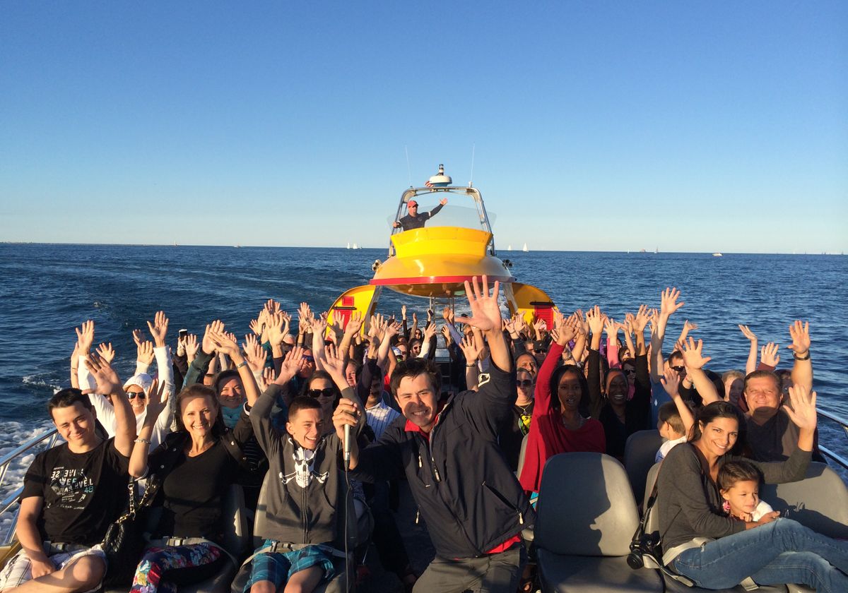 Tourists with Hands Up on Seadog Cruises