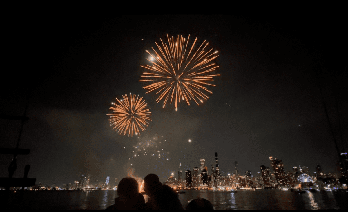 People Watching Fireworks Against Chicago Skyline from Tall Ship Windy at Navy Pier