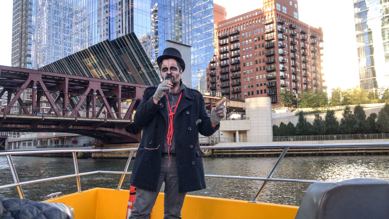 Haunted Seadog Cruise Tour Guide In Halloween Costume in Front of a Bridge