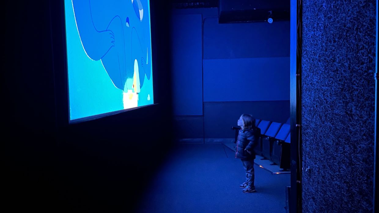 My First Movies Kid Watching A Movie In A Theater at Navy Pier