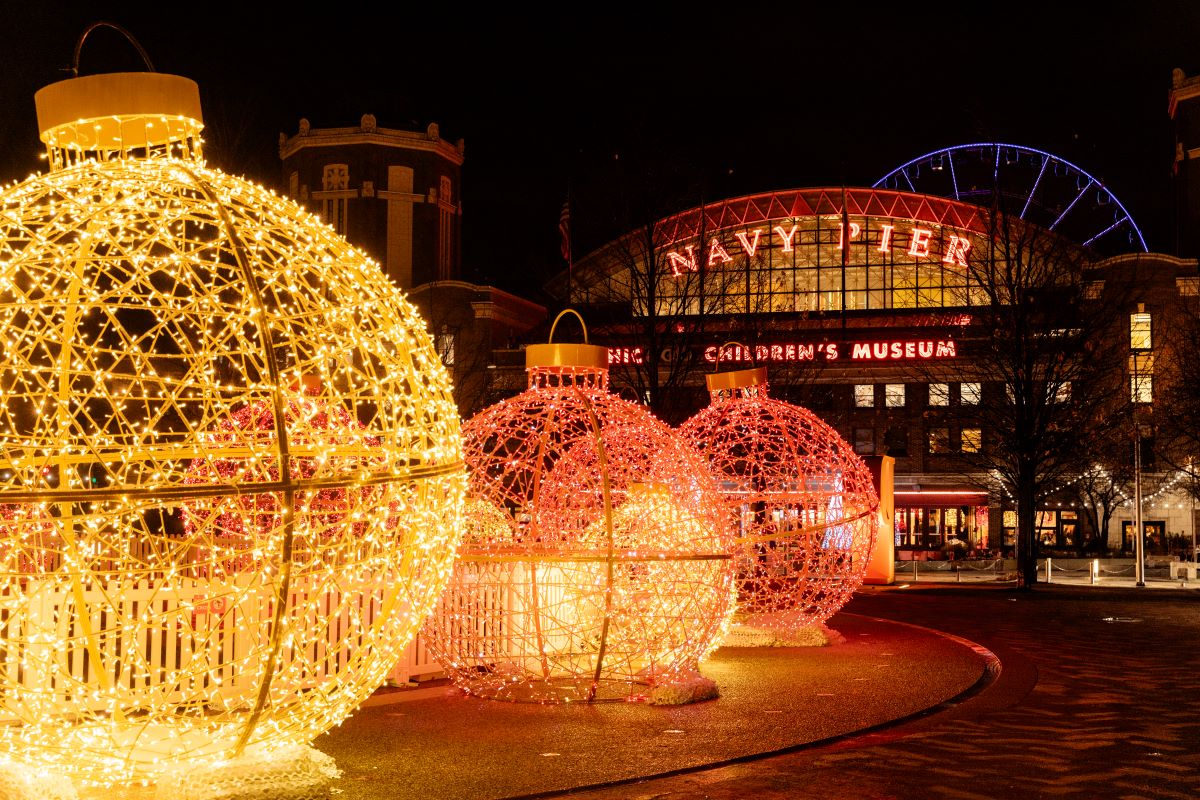 holiday lights at night in front of Navy Pier