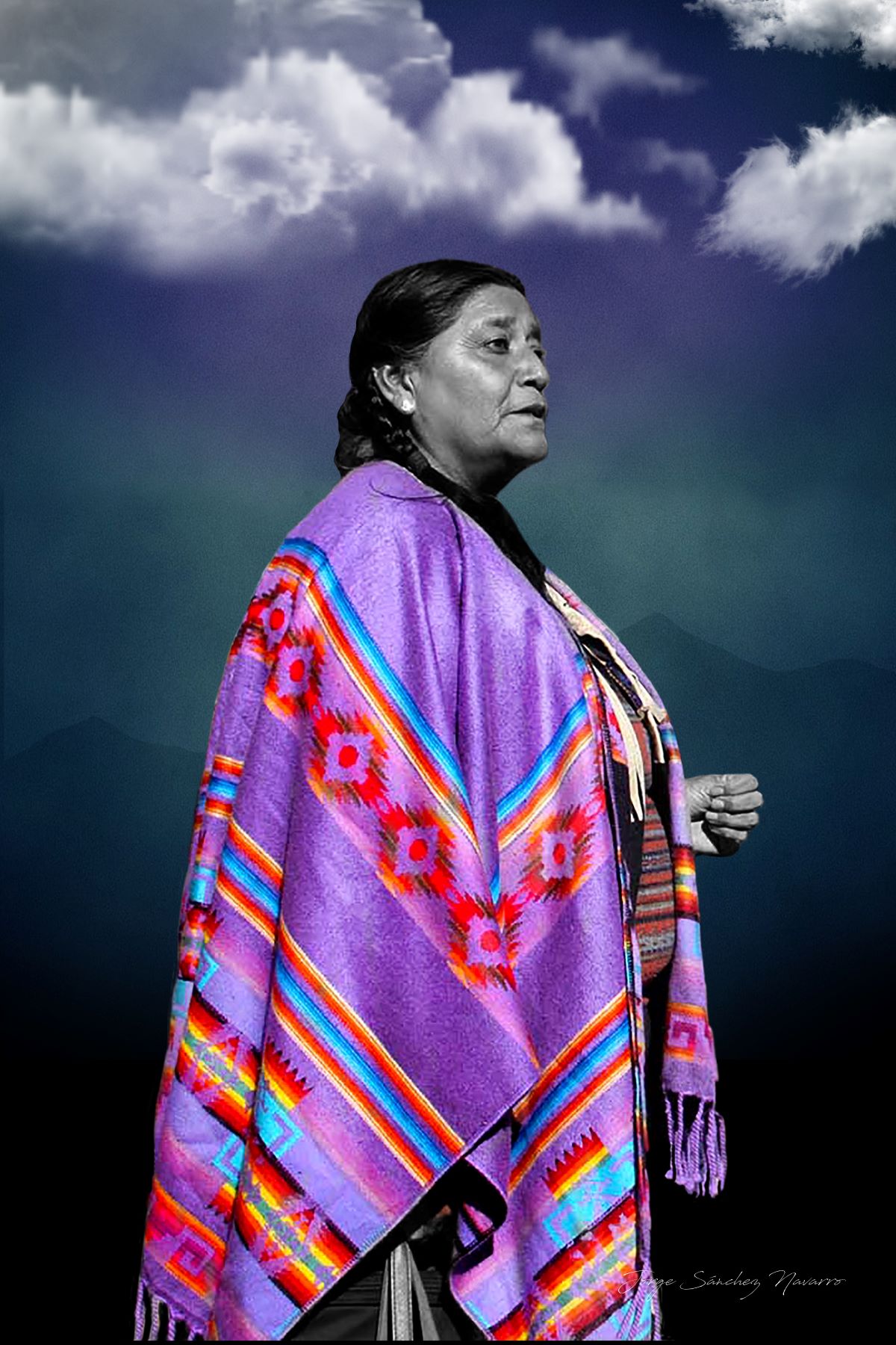 Portrait of Jorge Sanchez wearing a distinctive patterned shawl