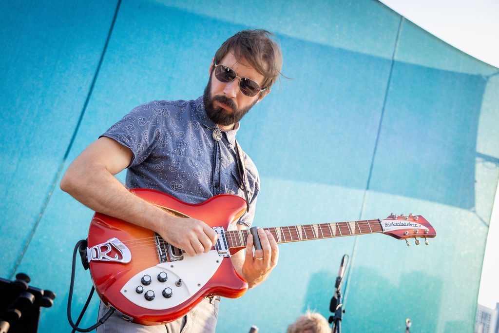 Musician plays electric guitar during Skyline Sessions at Navy Pier