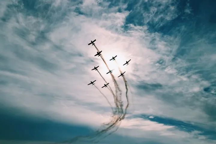 aerial view of fleet of airplanes in the sky