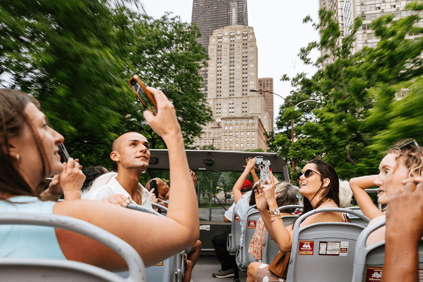 tourists enjoying a Big Bus Chicago tour with city views