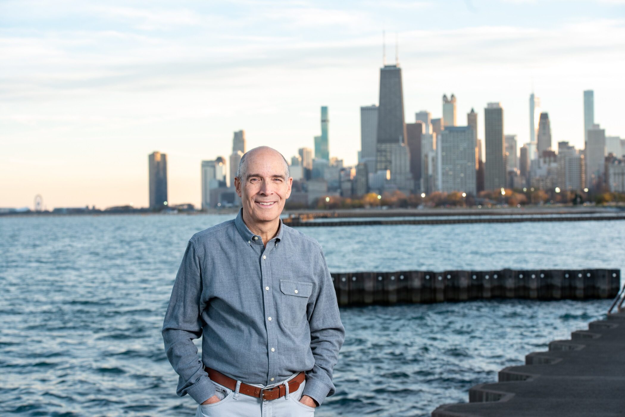 Geoffrey Baer at Chicago's Lakefront with skyline view, near Navy Pier.