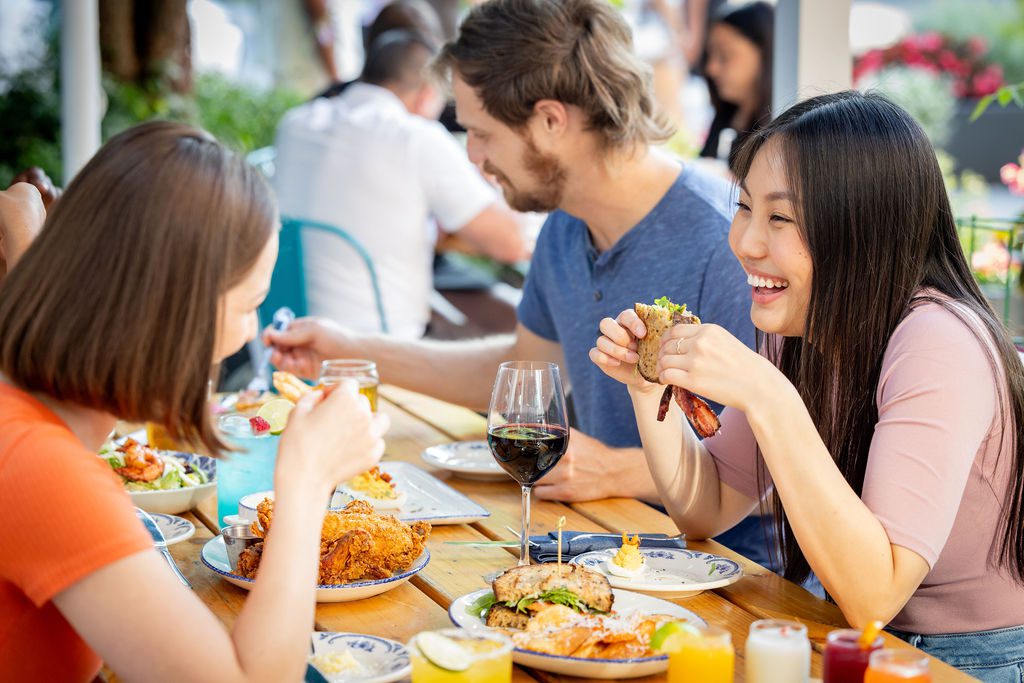 friends enjoying delicious food and drinks at Navy Pier's Patio Bingo event