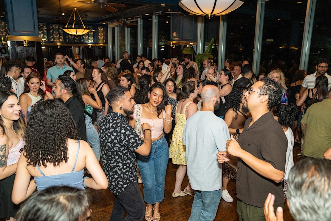 Crowd enjoying lively dancing at ¡Pachanga! event on Navy Pier in Chicago.