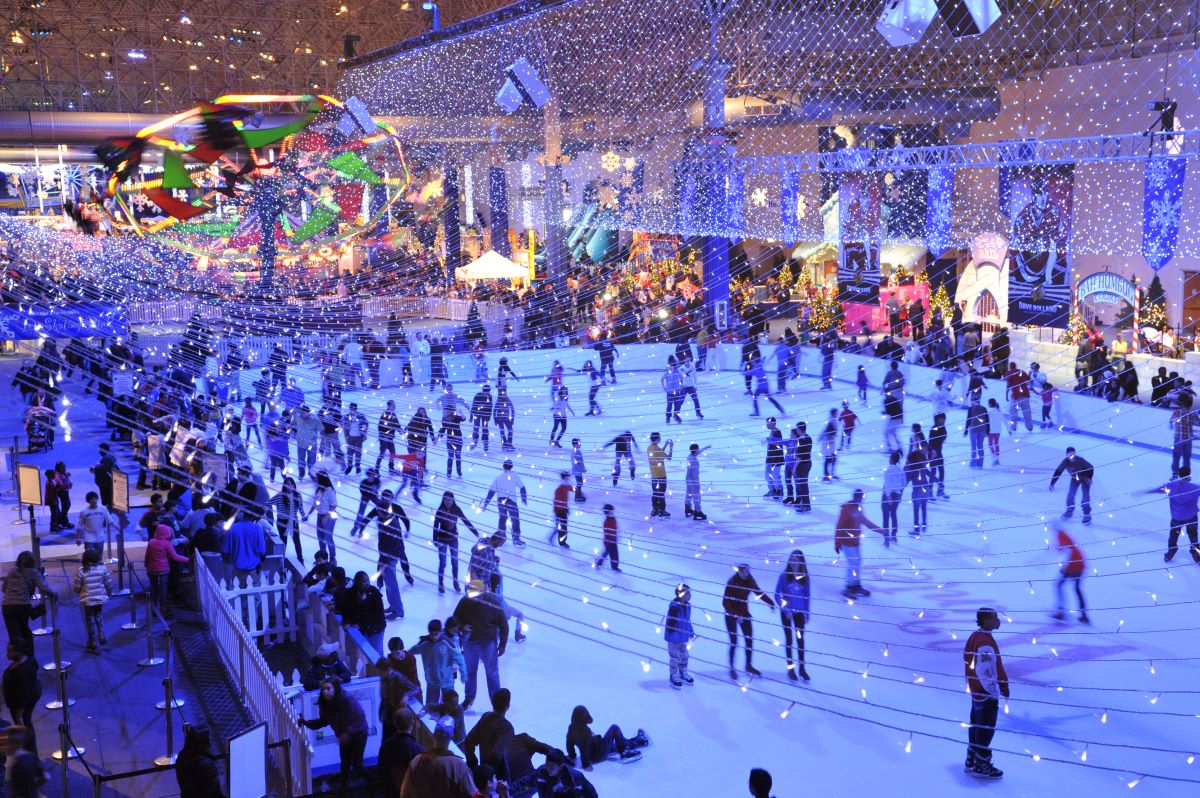 Families enjoying ice skating at Winter WonderFest, Navy Pier's festive indoor event.