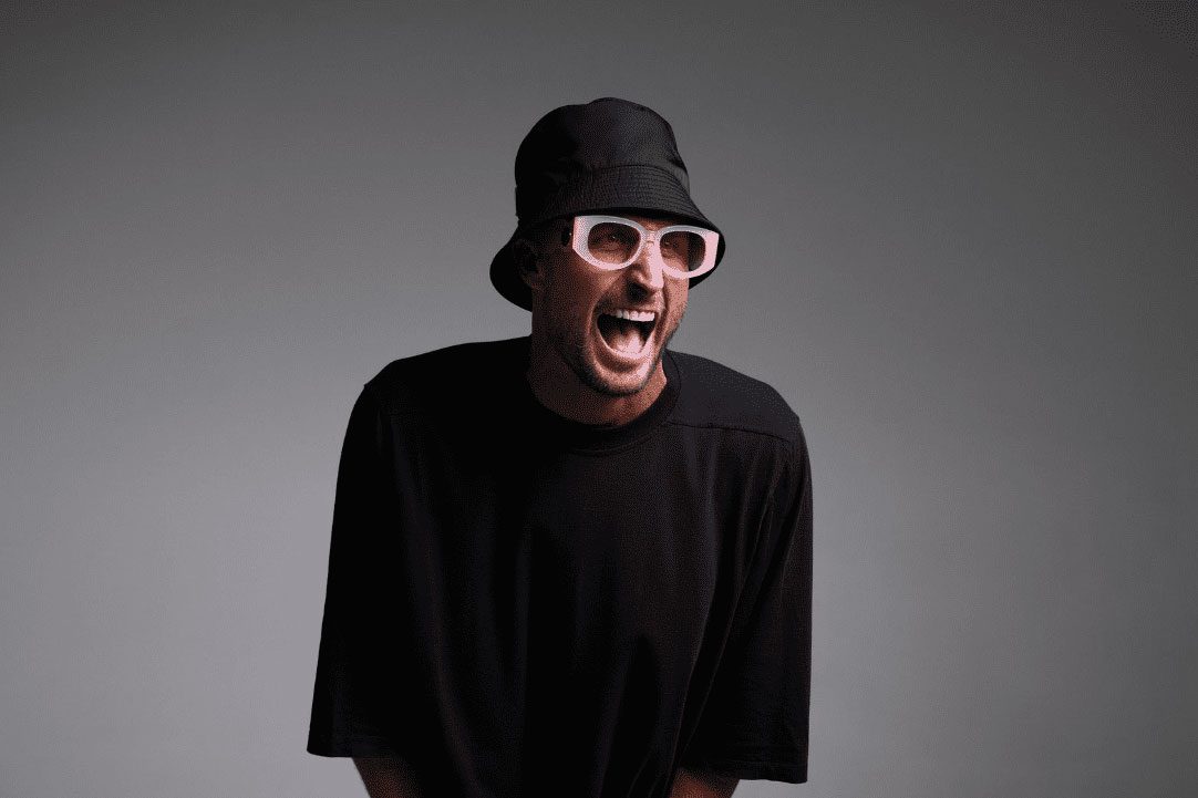 Promotional graphic featuring electronic music artist FISHER