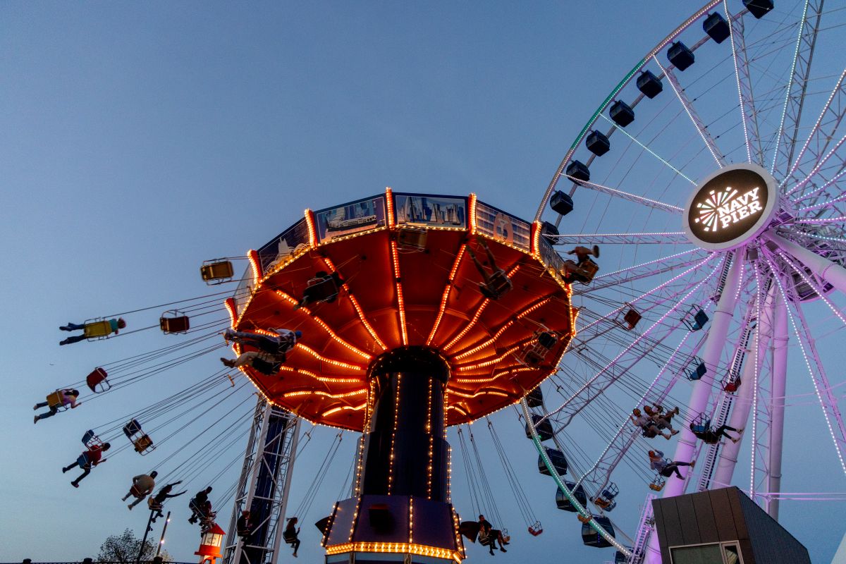 Ferris wheel and swing ride attraction at Navy Pier amusement area