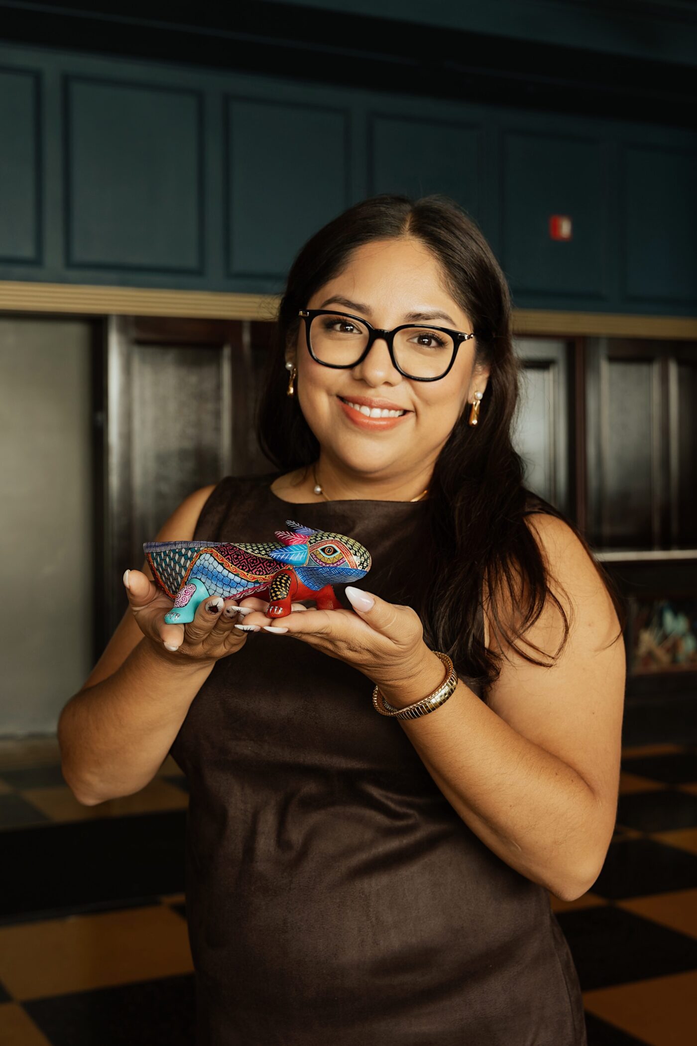 Portrait of a woman holding a statue at Small Business Accelerator Program