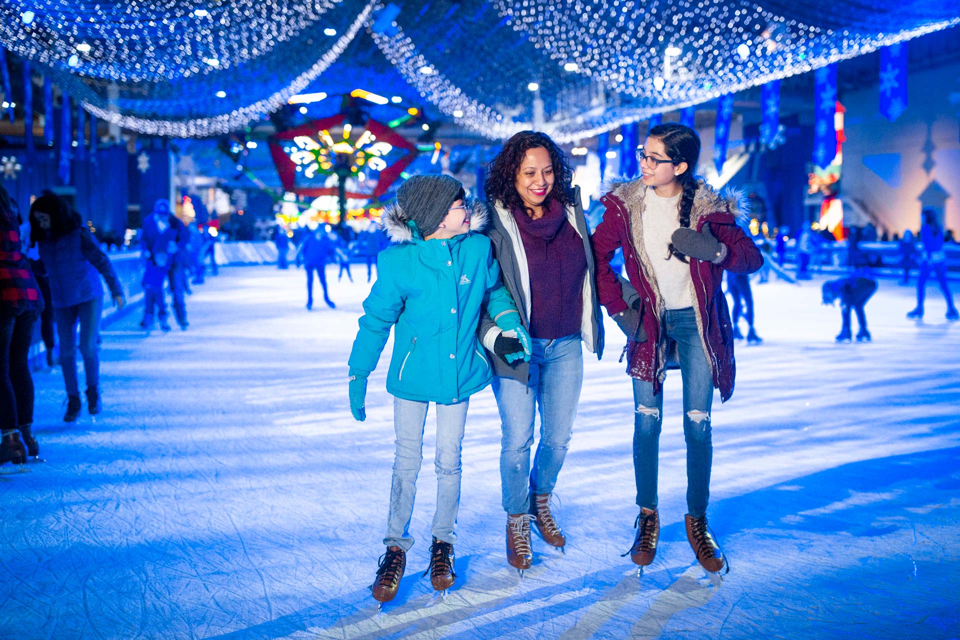 Families enjoy ice skating at Winter WonderFest on Navy Pier in Chicago.