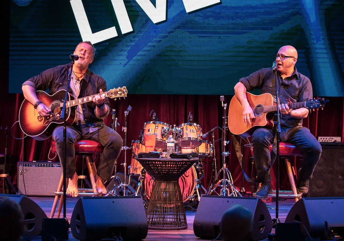 Acoustic duo performing on stage at a City Cruises event at Navy Pier