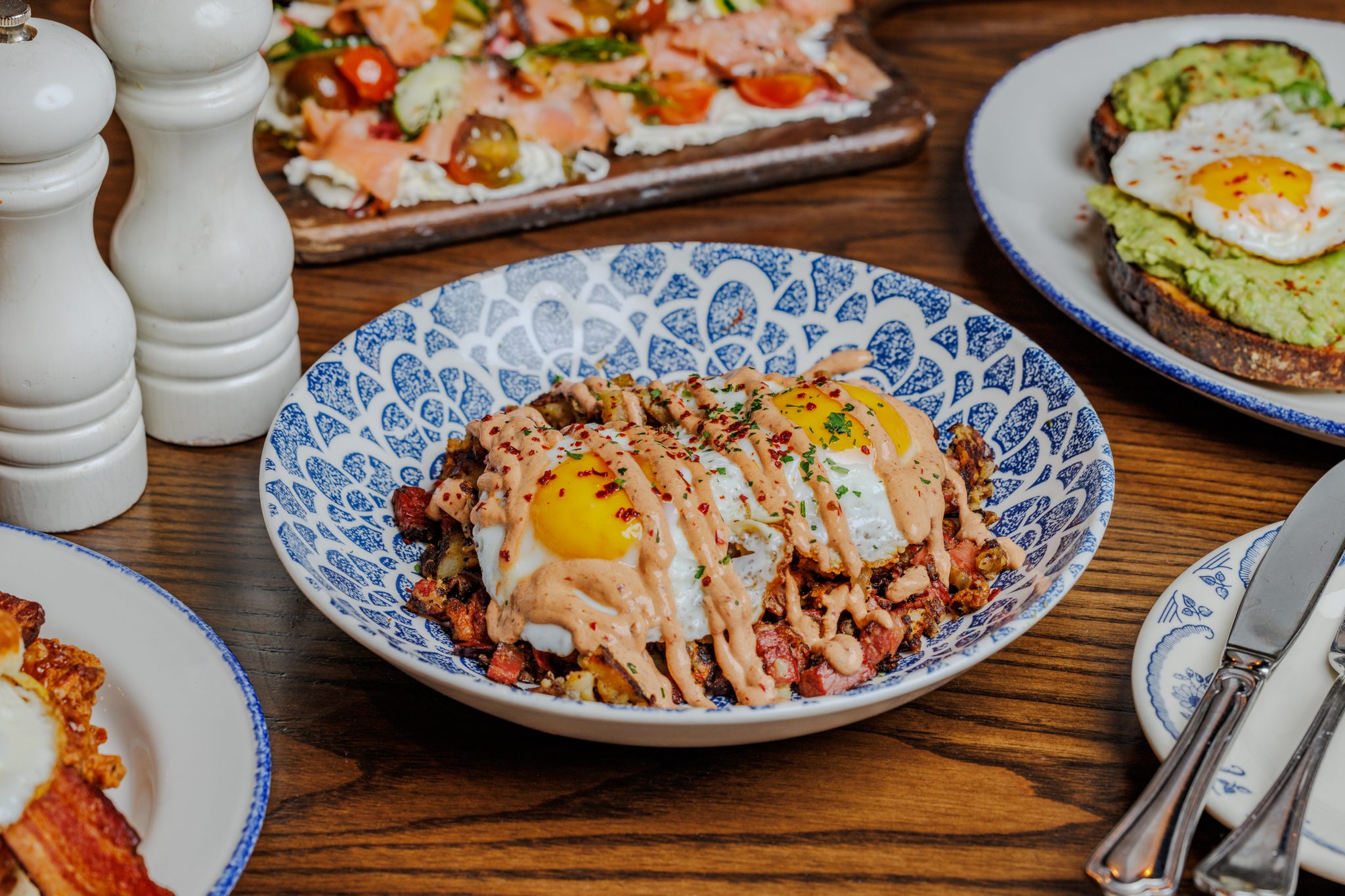 Brisket hash with poached eggs and sauce on a plate at a Navy Pier restaurant