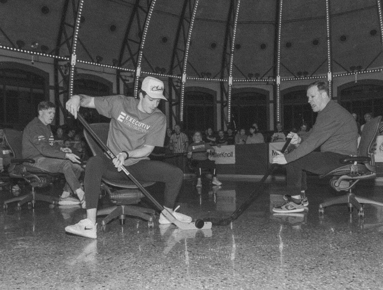 Players competing in an office chair hockey game at Navy Pier