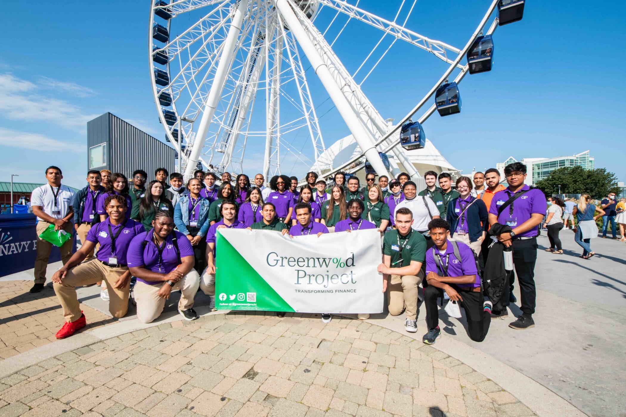 High school students posing with a Greenwood Project banner at Navy Pier