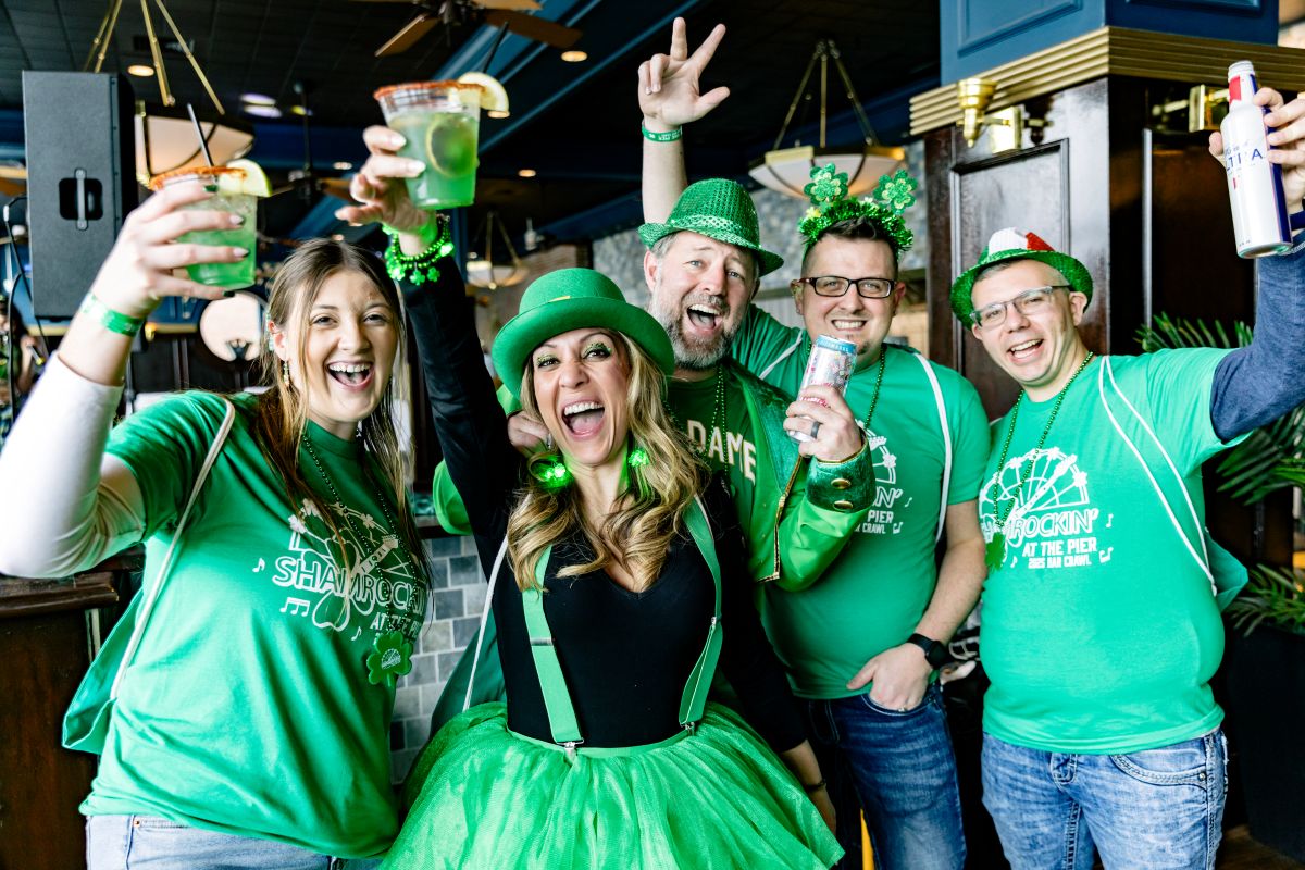 Guests in green celebrating at a St. Patrick's Day event at Navy Pier