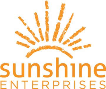 Sunshine Enterprises logo with orange sunburst rays and stacked text