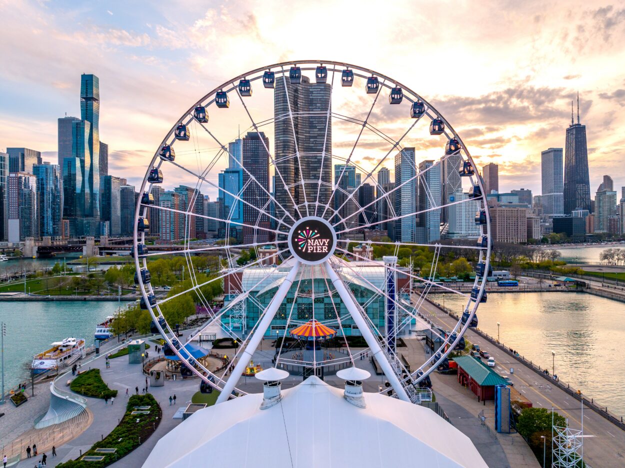 Aerial view of the Navy Pier Ferris wheel with the Chicago skyline beyond