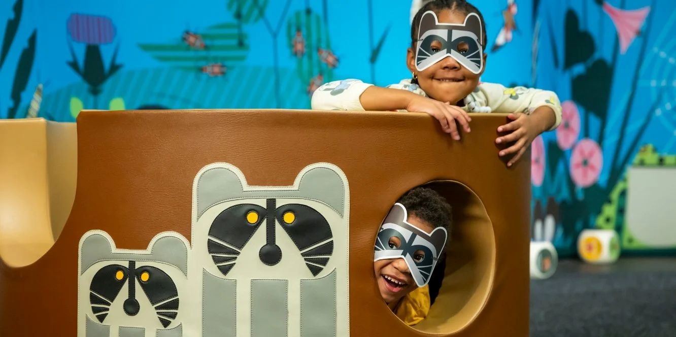 Children wearing animal masks playing in an activity area at Navy Pier
