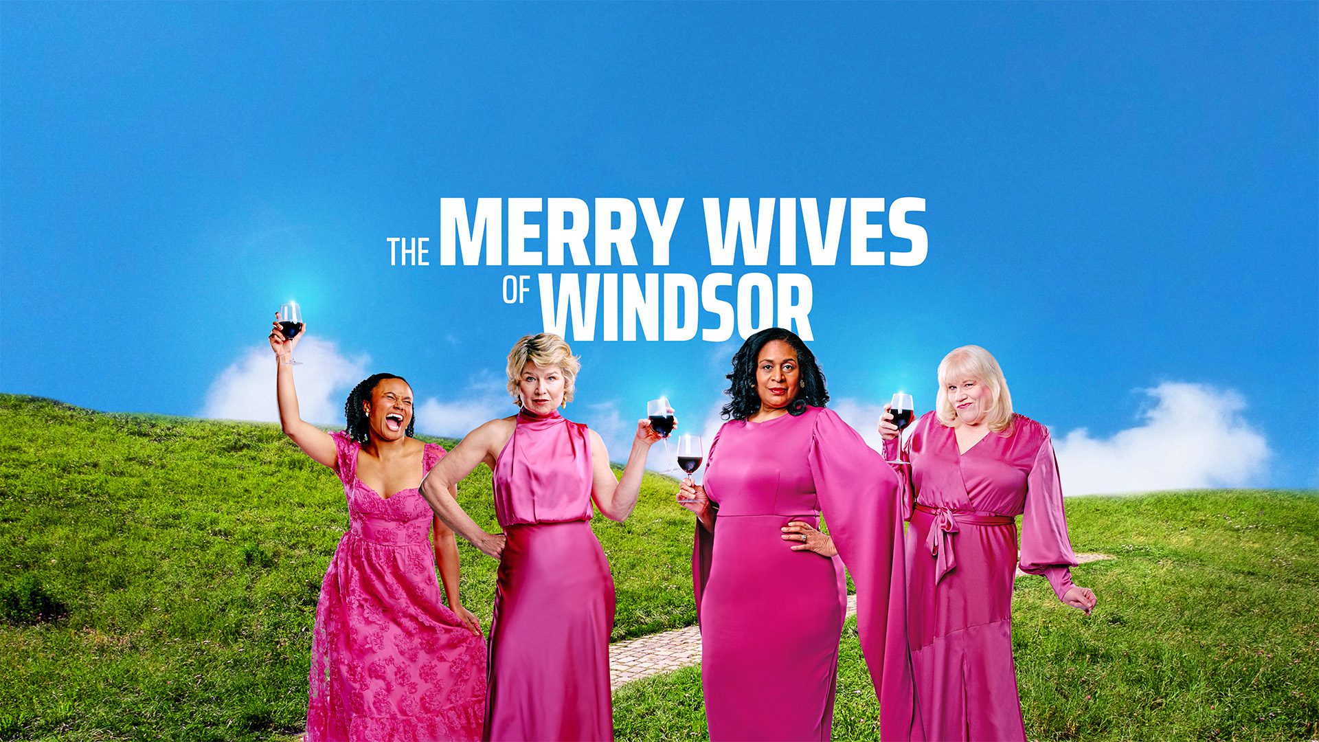 Four women in pink dresses holding wine glasses at an outdoor Navy Pier event