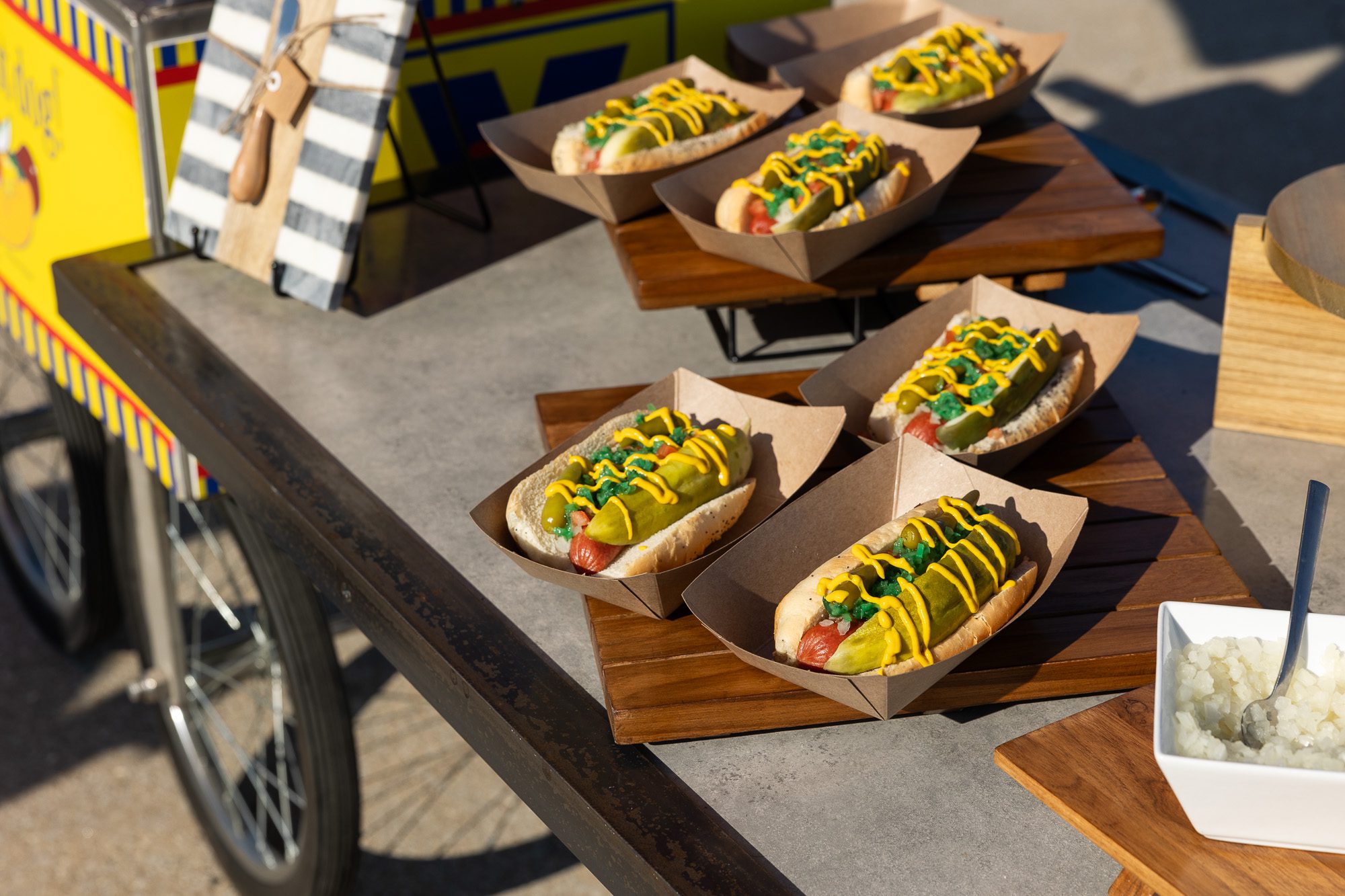 Hot dogs topped with mustard and relish at a Navy Pier food cart