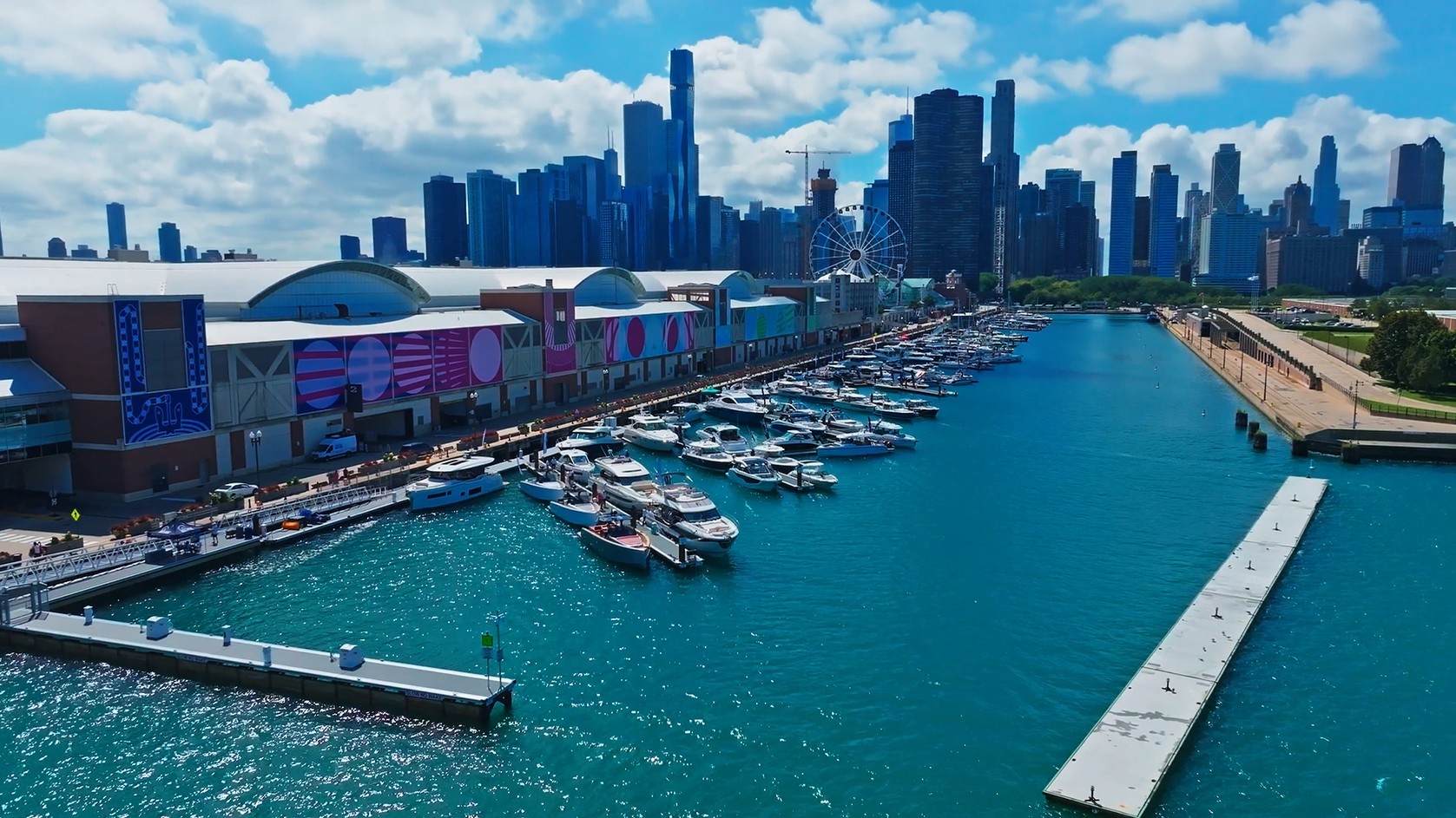 Aerial view of Navy Pier marina with docked boats and the Chicago skyline