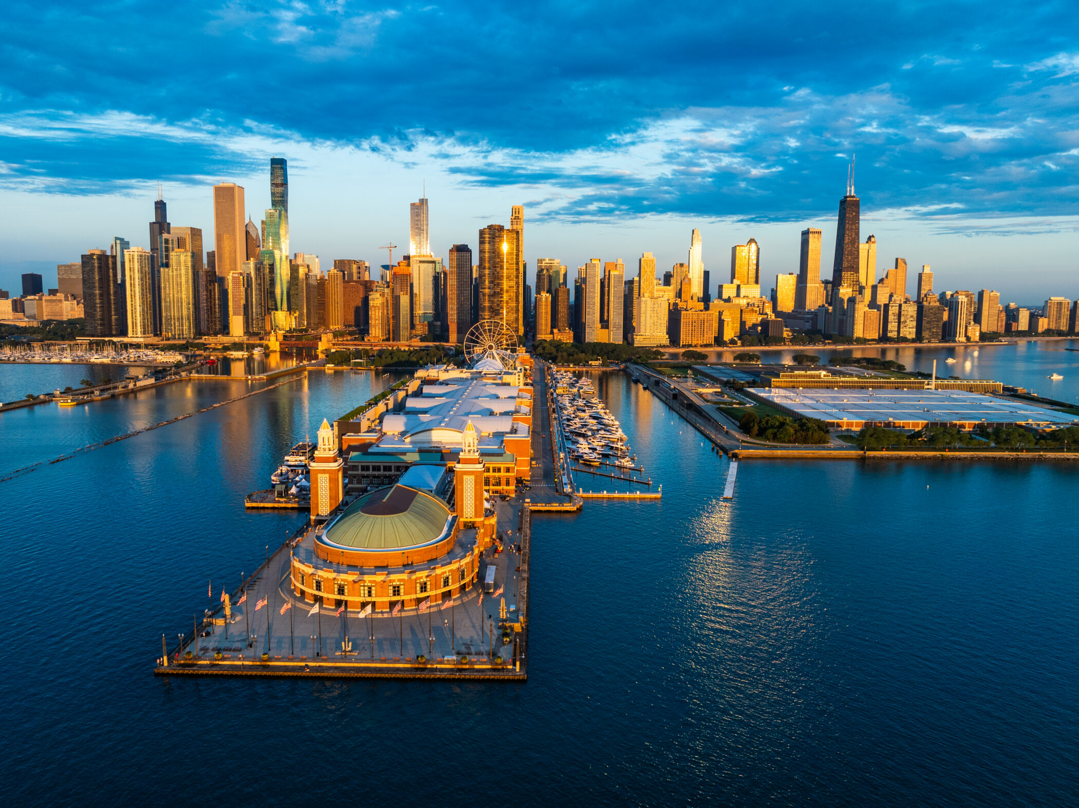Aerial view of Navy Pier and Chicago skyline at sunset