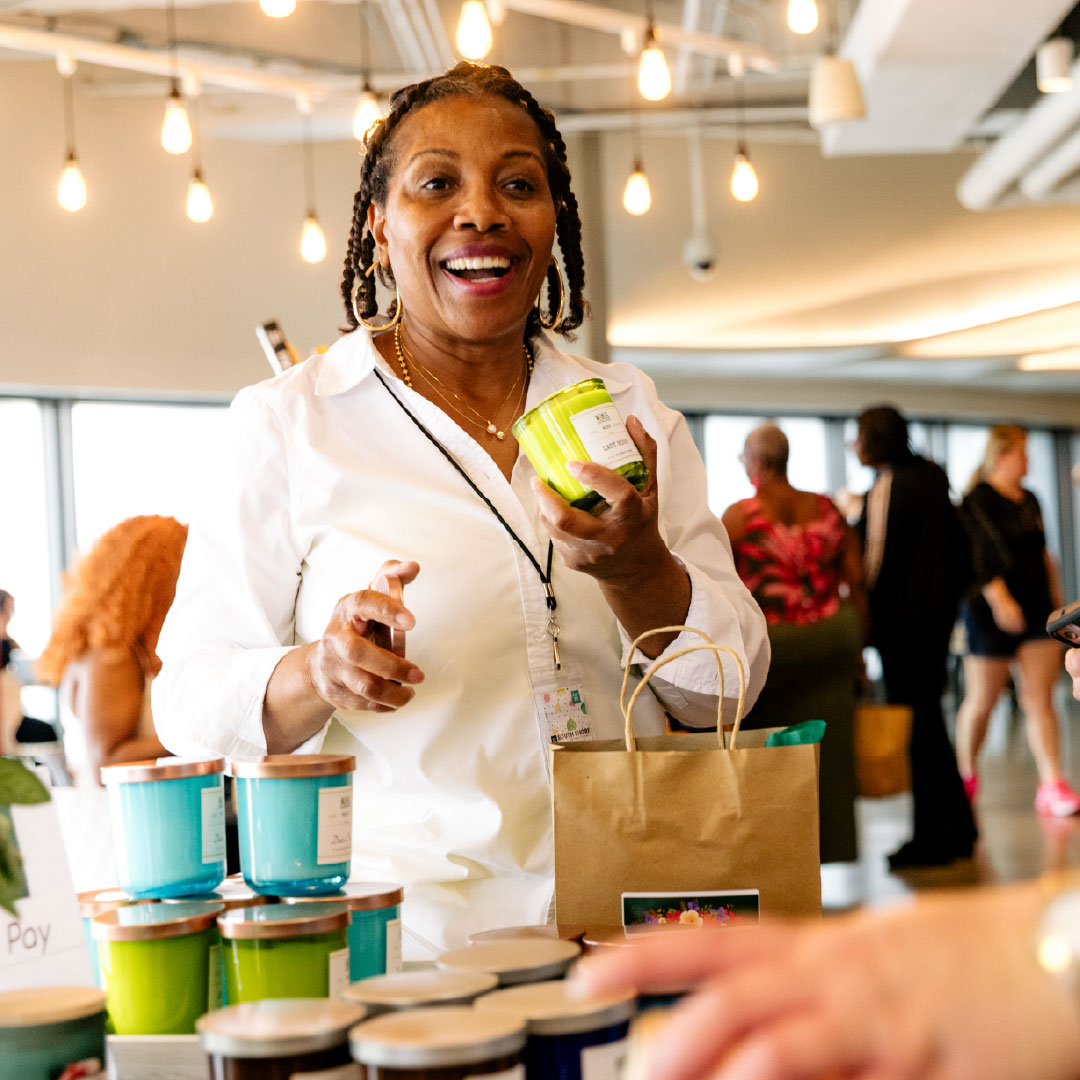 Woman selling candles and a market event at Navy Pier