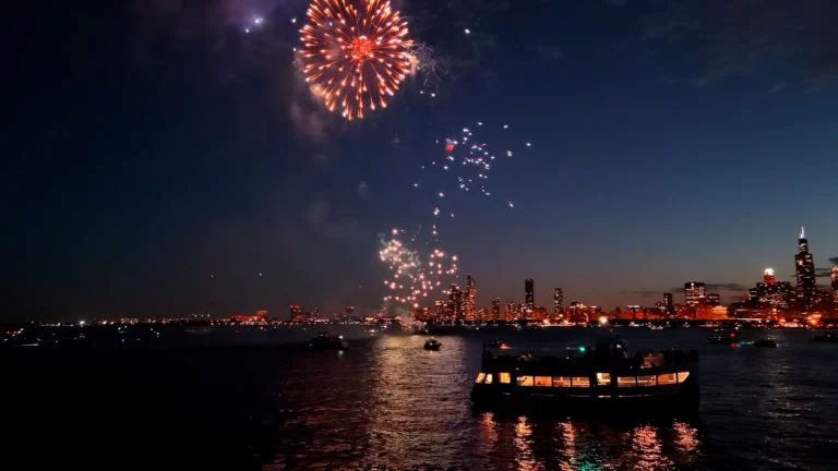 Fireworks over the Chicago skyline seen from a lake cruise boat